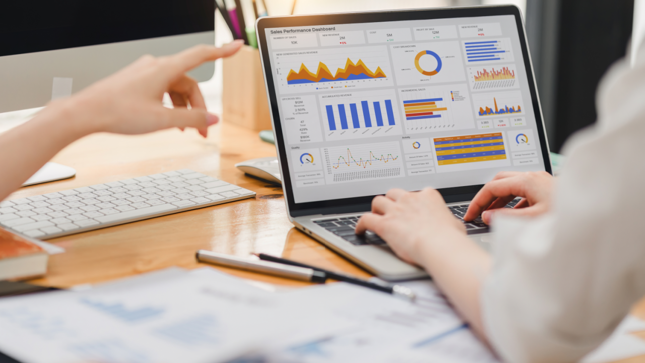 Cost of hiring an accountant shown through financial dashboard analysis on laptop