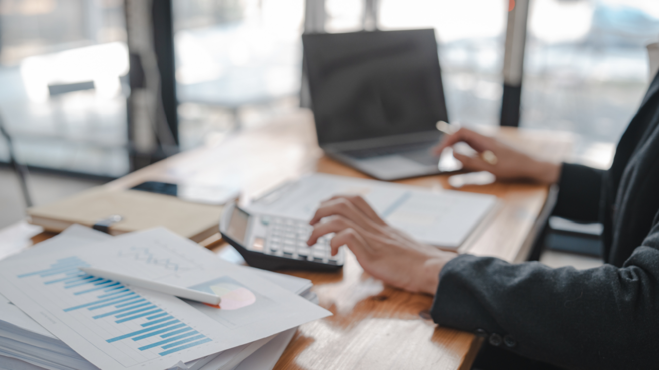 how to find a CPA reviewing financial charts and reports at a desk