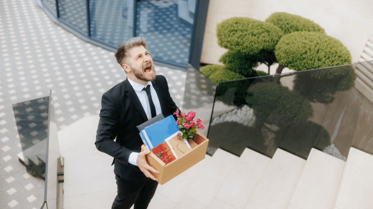Man carrying box after wrongful termination